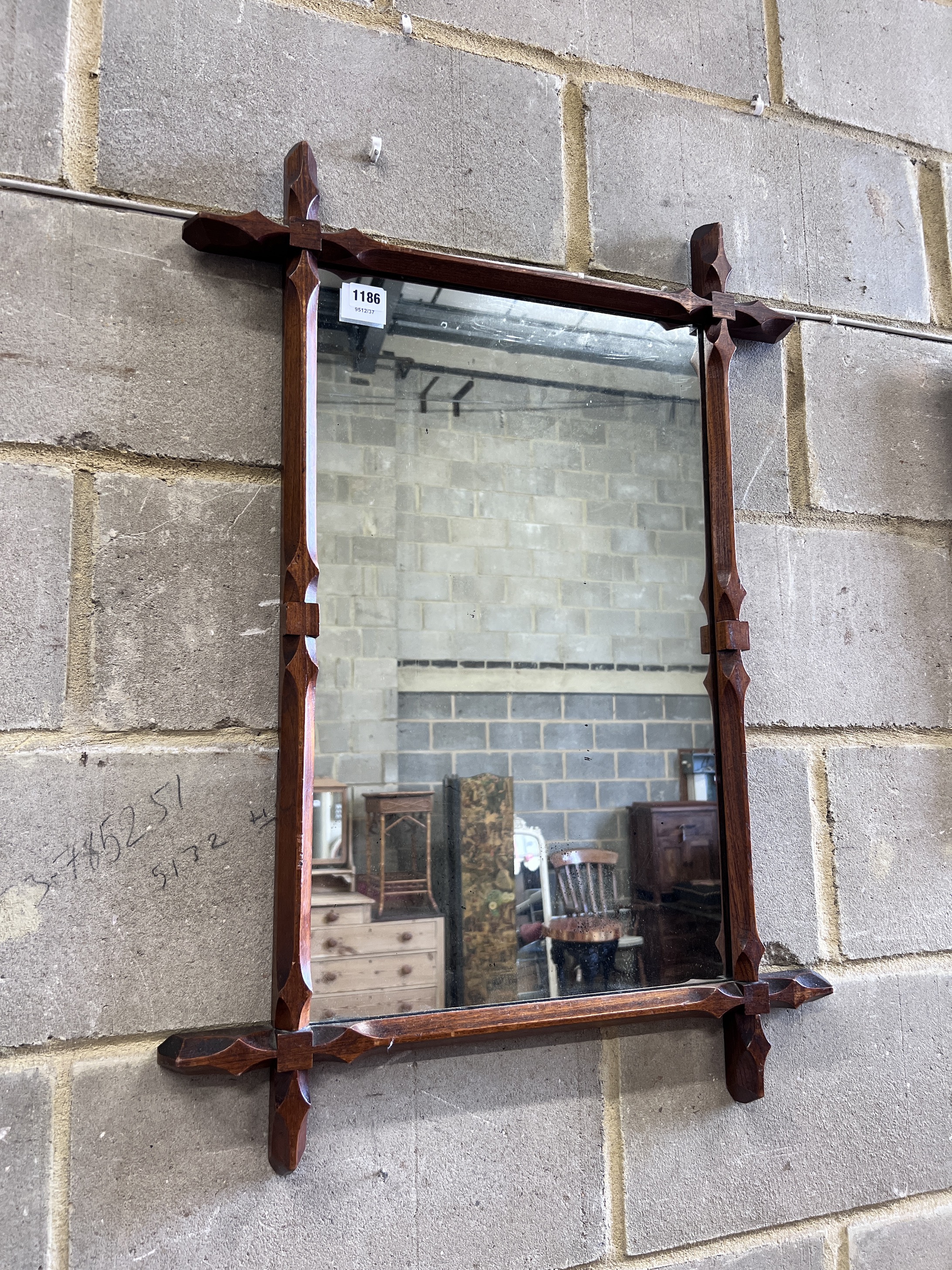 A late Victorian oak wall mirror, width 61cm, height 84cm